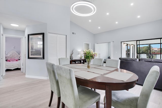 1102 Republic Ct, Deerfield Beach, FL 33442 - dining area featuring light wood-style flooring, high vaulted ceiling, and recessed lighting