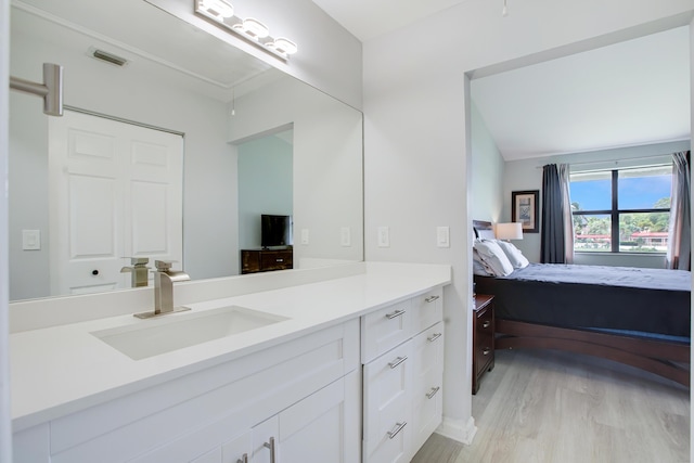 1102 Republic Ct, Deerfield Beach, FL 33442 - bathroom featuring vanity, ensuite bath, and wood finished floors