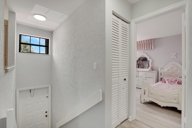 1102 Republic Ct, Deerfield Beach, FL 33442 - corridor featuring wood finished floors and a textured wall