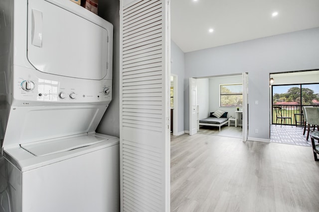 1102 Republic Ct, Deerfield Beach, FL 33442 - laundry area featuring stacked washer / drying machine, light wood-style flooring, and recessed lighting