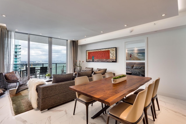 488 NE 18th St Unit 4711, Miami, FL 33132 - dining space featuring light marble finish flooring, a wall of windows, a water view, and recessed lighting