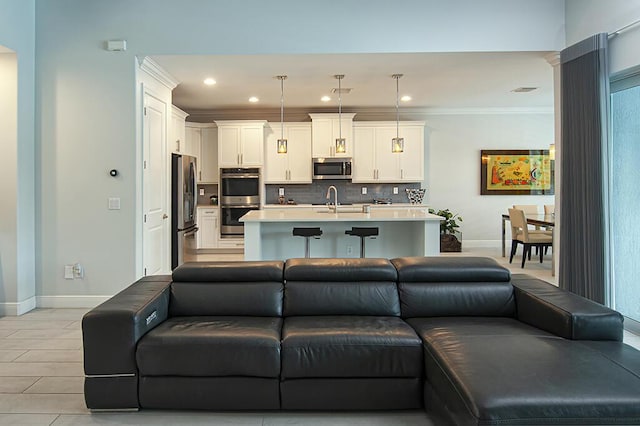 3165 Berkley Square Way, Vero Beach, FL 32966 - living room featuring recessed lighting and ornamental molding