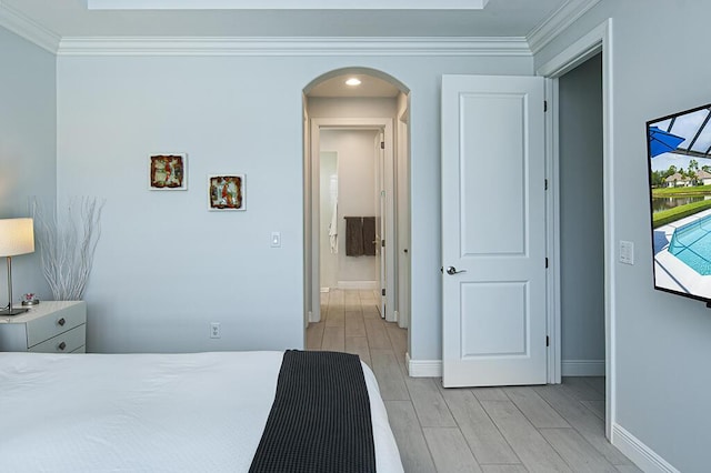 3165 Berkley Square Way, Vero Beach, FL 32966 - bedroom with arched walkways, ornamental molding, and wood tiled floors