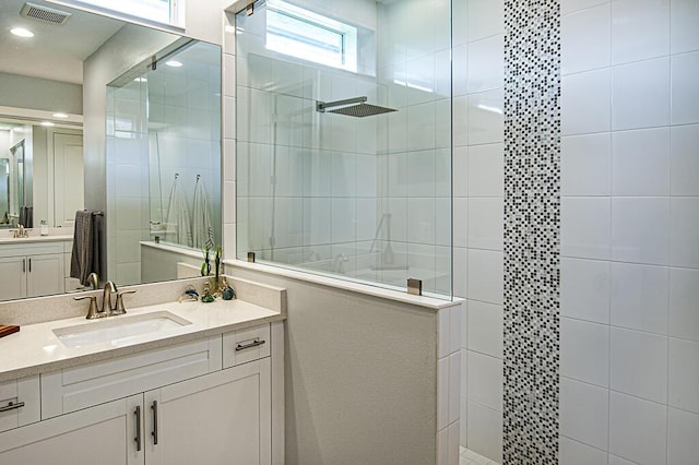 3165 Berkley Square Way, Vero Beach, FL 32966 - bathroom featuring walk in shower and vanity