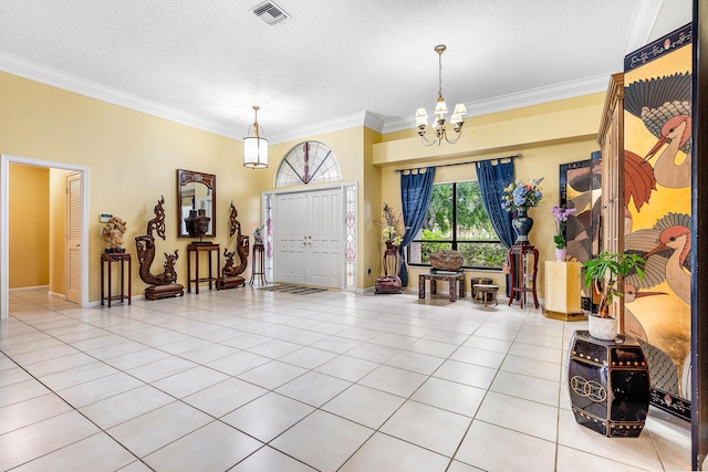 2029 Greenview Cove Dr, Wellington, FL 33414 - foyer entrance with a chandelier, crown molding, a textured ceiling, and light tile patterned floors
