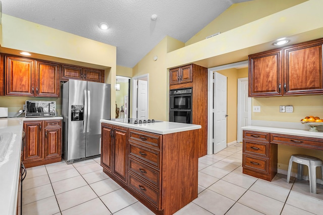 2029 Greenview Cove Dr, Wellington, FL 33414 - kitchen featuring black appliances, vaulted ceiling, light countertops, a center island, and light tile patterned floors
