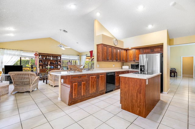 2029 Greenview Cove Dr, Wellington, FL 33414 - kitchen featuring dishwasher, lofted ceiling, light countertops, a peninsula, and light tile patterned floors