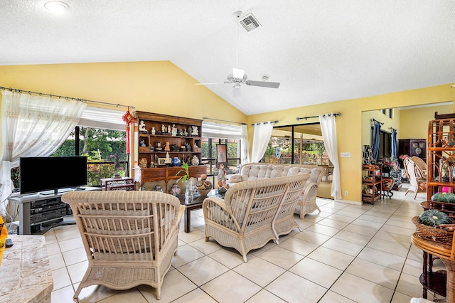 2029 Greenview Cove Dr, Wellington, FL 33414 - living area with lofted ceiling, ceiling fan, healthy amount of natural light, a textured ceiling, and light tile patterned floors