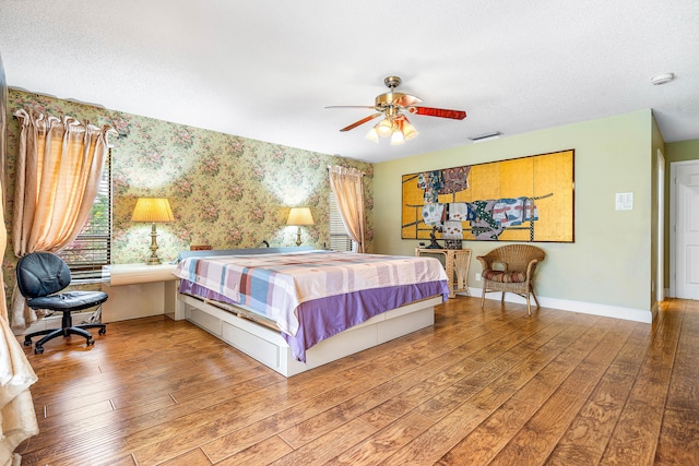 2029 Greenview Cove Dr, Wellington, FL 33414 - bedroom featuring wallpapered walls, wood finished floors, ceiling fan, and a textured ceiling