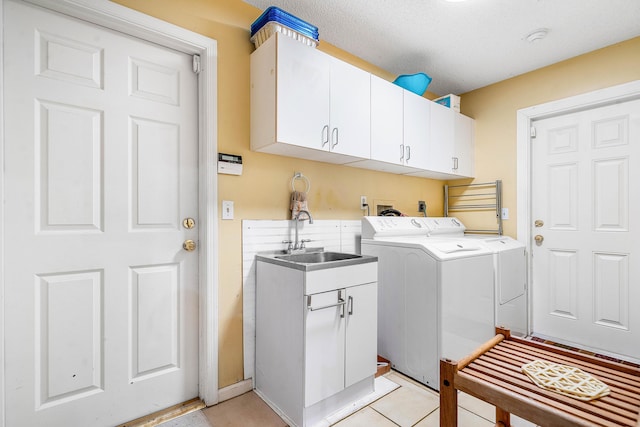 2029 Greenview Cove Dr, Wellington, FL 33414 - laundry area featuring washer and dryer, cabinet space, and light tile patterned flooring