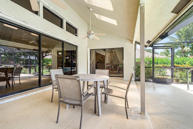 2029 Greenview Cove Dr, Wellington, FL 33414 - sunroom / solarium with ceiling fan, outdoor dining area, lofted ceiling, and a skylight