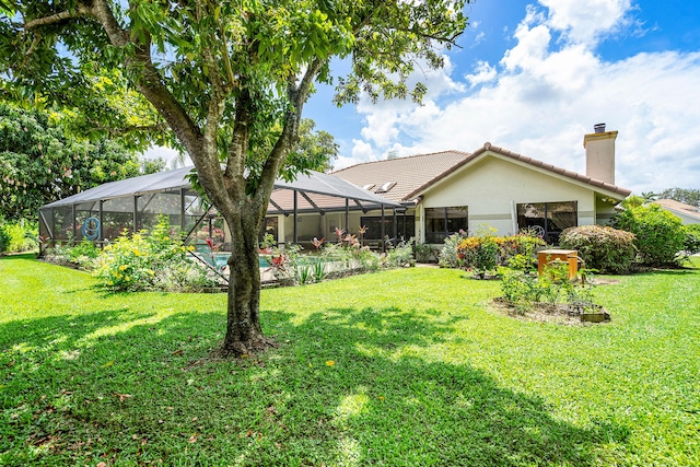 2029 Greenview Cove Dr, Wellington, FL 33414 - rear view of house with a tile roof, stucco siding, a yard, and a chimney