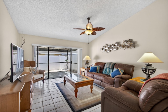 4640 Homestead Way Unit 39, West Palm Beach, FL 33417 - tiled living room with ceiling fan, a textured ceiling, and lofted ceiling