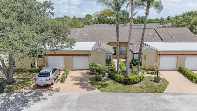 4640 Homestead Way Unit 39, West Palm Beach, FL 33417 - townhome / multi-family property featuring stucco siding, driveway, and a garage