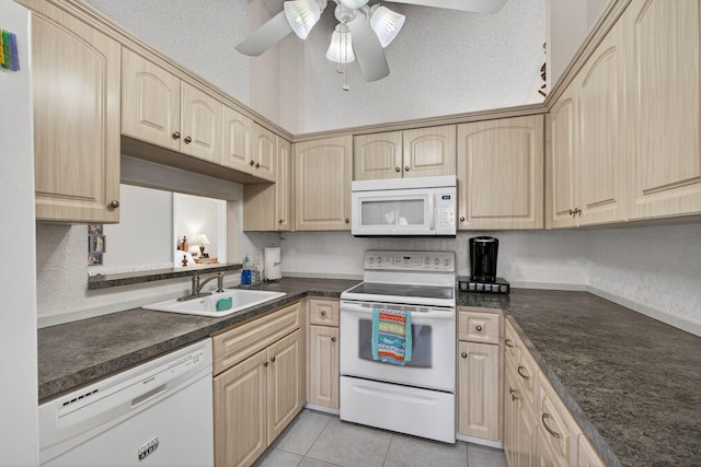 4640 Homestead Way Unit 39, West Palm Beach, FL 33417 - kitchen with white appliances, light brown cabinetry, ceiling fan, dark countertops, and light tile patterned floors