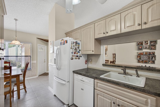 4640 Homestead Way Unit 39, West Palm Beach, FL 33417 - kitchen featuring white appliances, dark countertops, a textured ceiling, light tile patterned floors, and hanging light fixtures