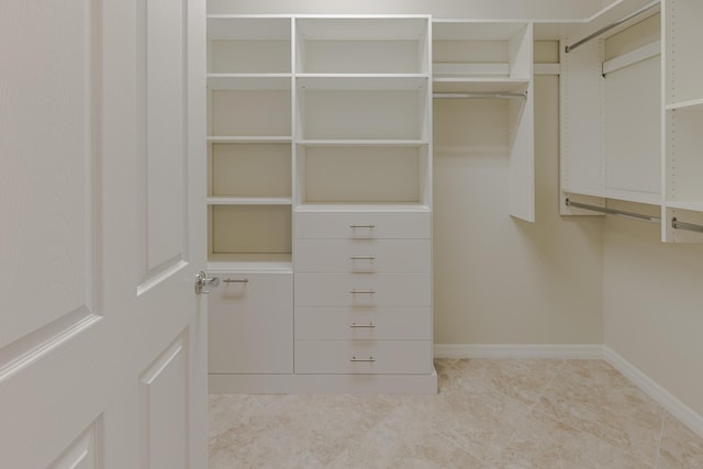 649 SE Monteiro Dr, Port Saint Lucie, FL 34984 - walk in closet with tile patterned floors