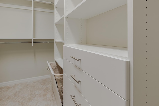 649 SE Monteiro Dr, Port Saint Lucie, FL 34984 - walk in closet with light tile patterned flooring