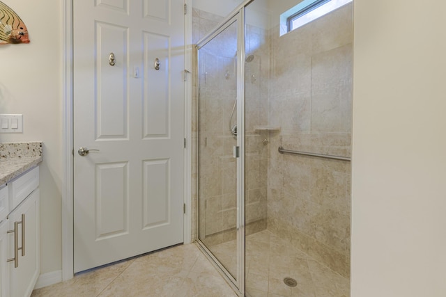 649 SE Monteiro Dr, Port Saint Lucie, FL 34984 - bathroom featuring vanity, a stall shower, and tile patterned floors