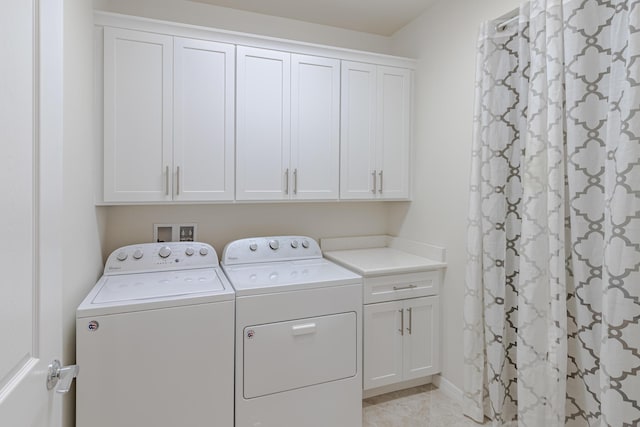 649 SE Monteiro Dr, Port Saint Lucie, FL 34984 - laundry area featuring washer and clothes dryer and cabinet space
