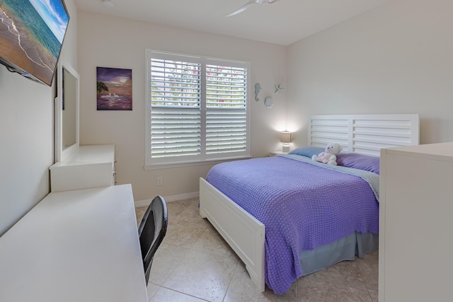 649 SE Monteiro Dr, Port Saint Lucie, FL 34984 - bedroom featuring baseboards and light tile patterned flooring