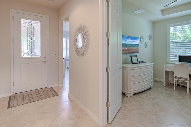 649 SE Monteiro Dr, Port Saint Lucie, FL 34984 - entryway with baseboards and light tile patterned flooring