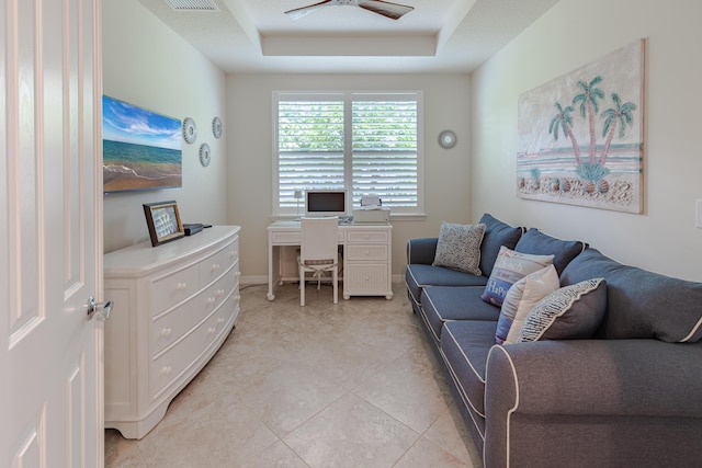 649 SE Monteiro Dr, Port Saint Lucie, FL 34984 - office space featuring a tray ceiling, light tile patterned flooring, and a ceiling fan