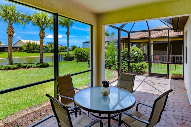 649 SE Monteiro Dr, Port Saint Lucie, FL 34984 - sunroom featuring a water view and outdoor dining space