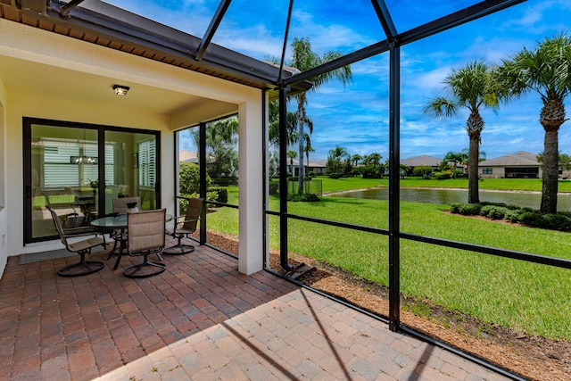 649 SE Monteiro Dr, Port Saint Lucie, FL 34984 - sunroom featuring a water view and outdoor dining space