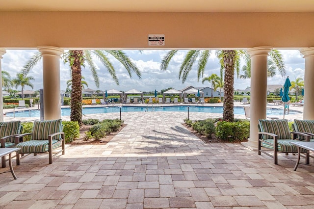 649 SE Monteiro Dr, Port Saint Lucie, FL 34984 - community pool featuring a patio