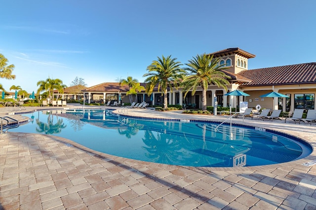 649 SE Monteiro Dr, Port Saint Lucie, FL 34984 - community pool with a patio