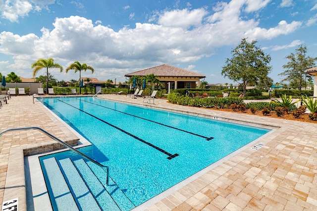 649 SE Monteiro Dr, Port Saint Lucie, FL 34984 - community pool featuring a patio area