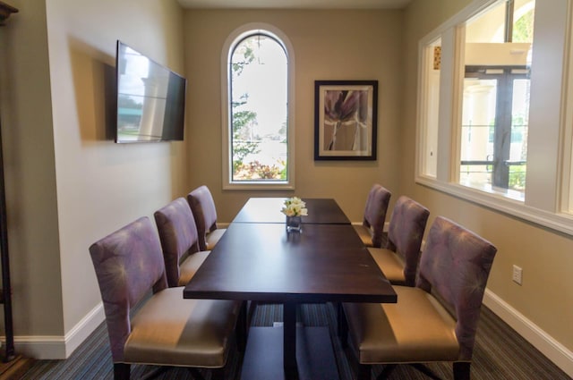 649 SE Monteiro Dr, Port Saint Lucie, FL 34984 - dining area with baseboards and carpet floors
