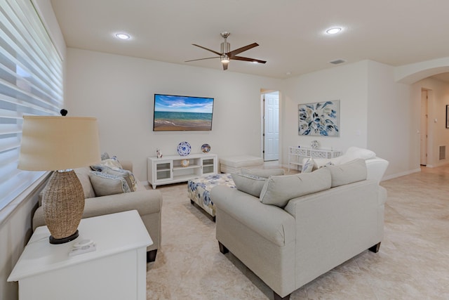 649 SE Monteiro Dr, Port Saint Lucie, FL 34984 - living room with arched walkways, ceiling fan, and recessed lighting