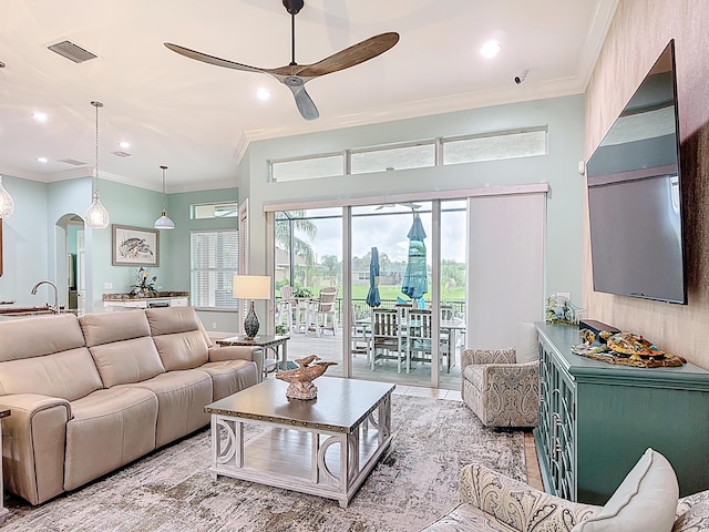 780 SW Fortunella Cir SW, Vero Beach, FL 32968 - living area with a ceiling fan, arched walkways, crown molding, and recessed lighting