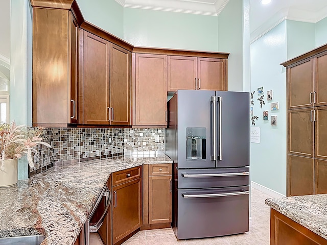780 SW Fortunella Cir SW, Vero Beach, FL 32968 - kitchen featuring high end refrigerator, crown molding, light stone counters, tasteful backsplash, and dishwasher