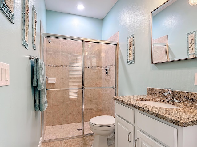780 SW Fortunella Cir SW, Vero Beach, FL 32968 - bathroom featuring vanity, a stall shower, and tile patterned flooring
