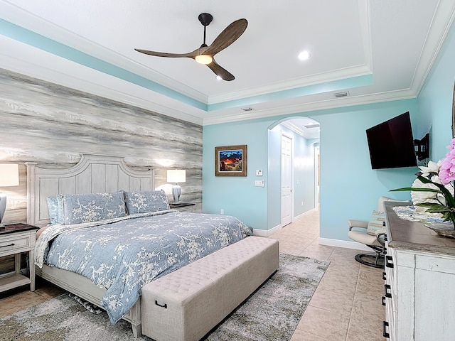 780 SW Fortunella Cir SW, Vero Beach, FL 32968 - tiled bedroom with arched walkways, an accent wall, ornamental molding, a ceiling fan, and recessed lighting