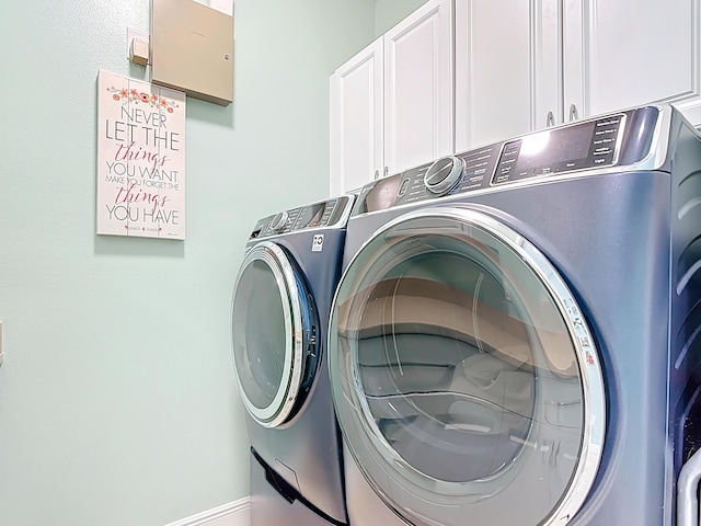 780 SW Fortunella Cir SW, Vero Beach, FL 32968 - washroom featuring cabinet space and washer and clothes dryer