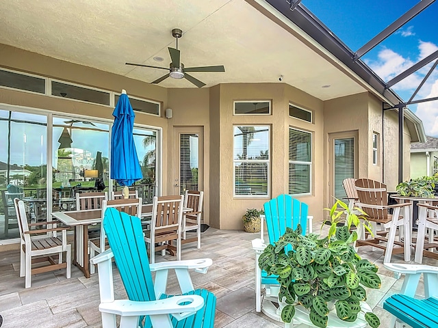 780 SW Fortunella Cir SW, Vero Beach, FL 32968 - deck with a ceiling fan, outdoor dining area, and a lanai