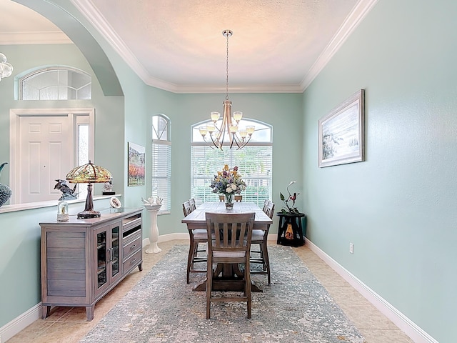 780 SW Fortunella Cir SW, Vero Beach, FL 32968 - dining area featuring a chandelier, crown molding, light tile patterned floors, and arched walkways