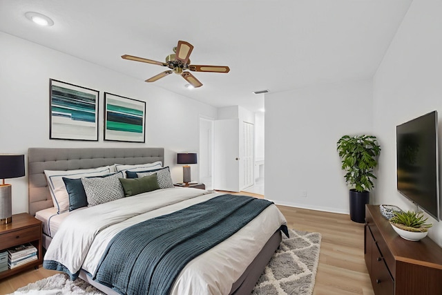 5791 Spindle Palm Ct Unit D, Delray Beach, FL 33484 - bedroom with light wood-style floors and ceiling fan