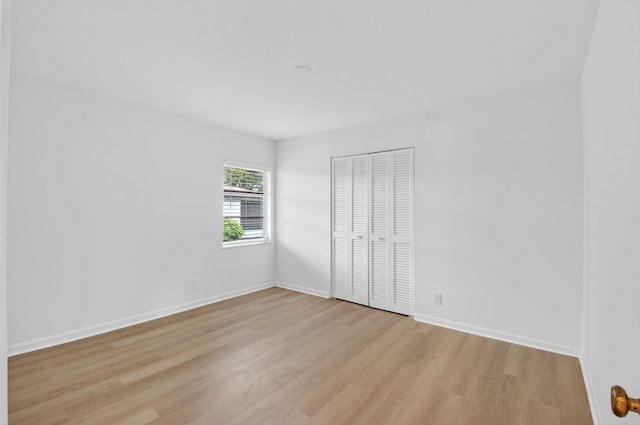 5791 Spindle Palm Ct Unit D, Delray Beach, FL 33484 - unfurnished bedroom with light wood-style flooring and a closet