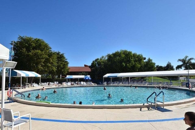 5791 Spindle Palm Ct Unit D, Delray Beach, FL 33484 - community pool featuring a patio