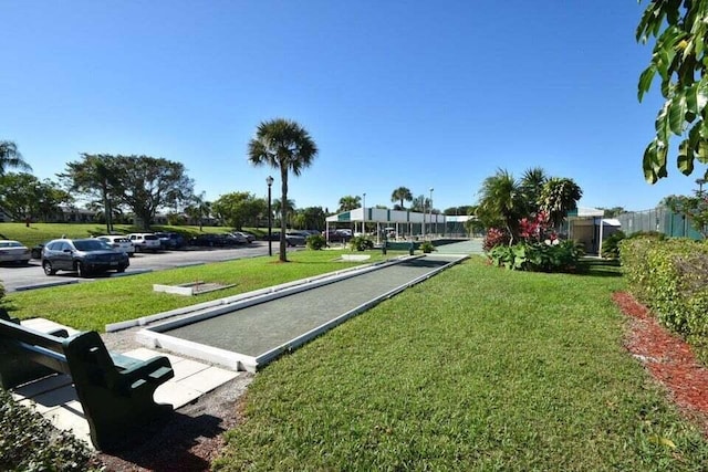 5791 Spindle Palm Ct Unit D, Delray Beach, FL 33484 - view of property's community featuring a game area, a yard, and uncovered parking