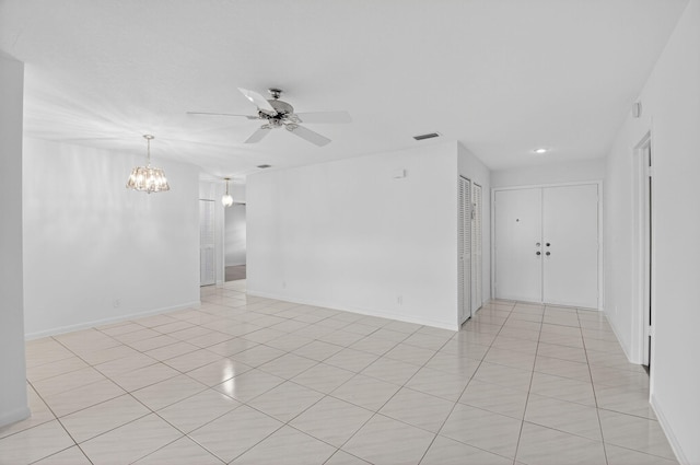 5791 Spindle Palm Ct Unit D, Delray Beach, FL 33484 - spare room with a ceiling fan, a chandelier, and light tile patterned floors