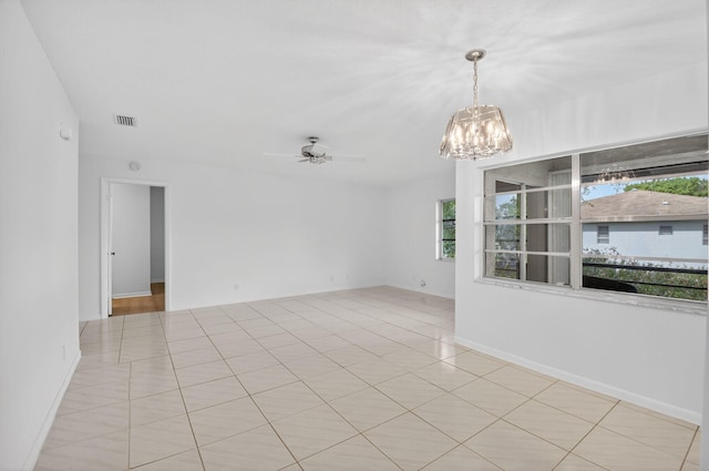 5791 Spindle Palm Ct Unit D, Delray Beach, FL 33484 - empty room with a chandelier, a ceiling fan, and tile patterned flooring