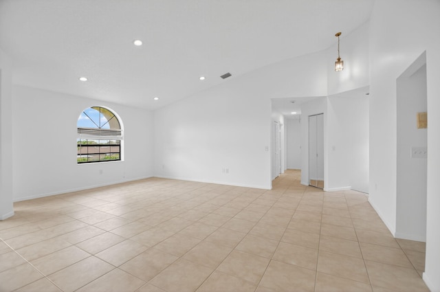 5235 Europa Dr Unit K, Boynton Beach, FL 33437 - spare room with light tile patterned floors, recessed lighting, and vaulted ceiling