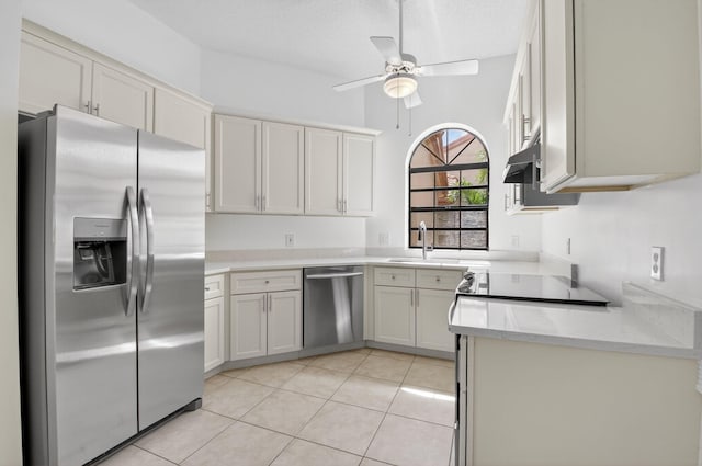 5235 Europa Dr Unit K, Boynton Beach, FL 33437 - kitchen featuring appliances with stainless steel finishes, a ceiling fan, light countertops, and light tile patterned flooring