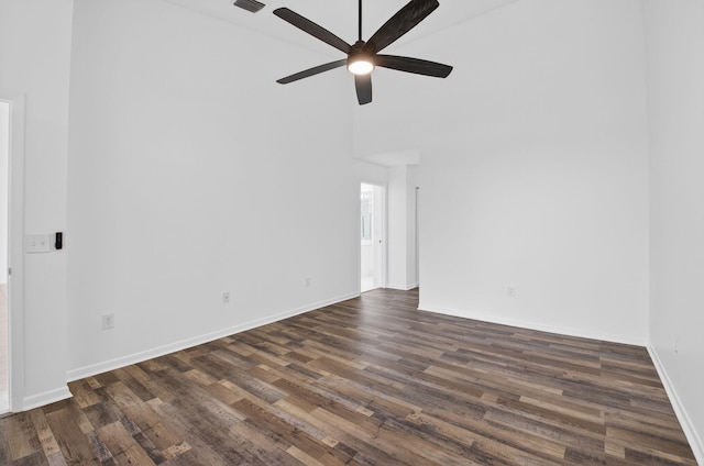 5235 Europa Dr Unit K, Boynton Beach, FL 33437 - unfurnished room featuring ceiling fan, dark wood finished floors, and a high ceiling